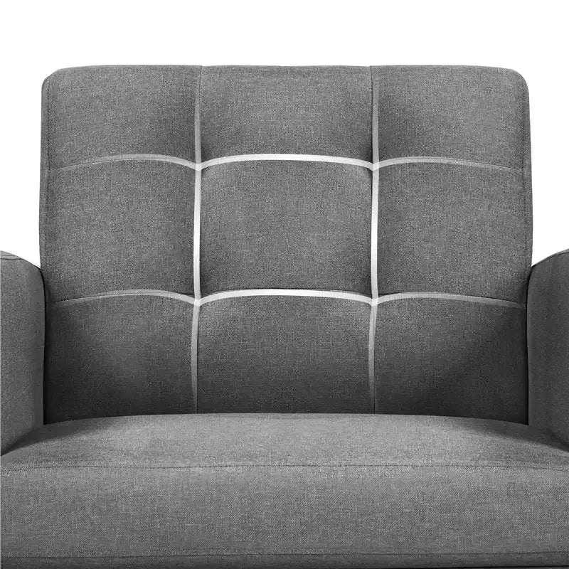 Poltrona moderna con rivestimento in tessuto capitonné e gambe in legno di gomma